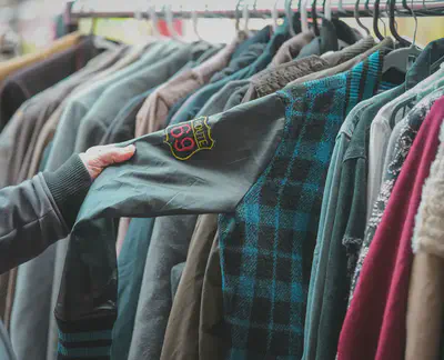 People browsing clothing at a community swap event